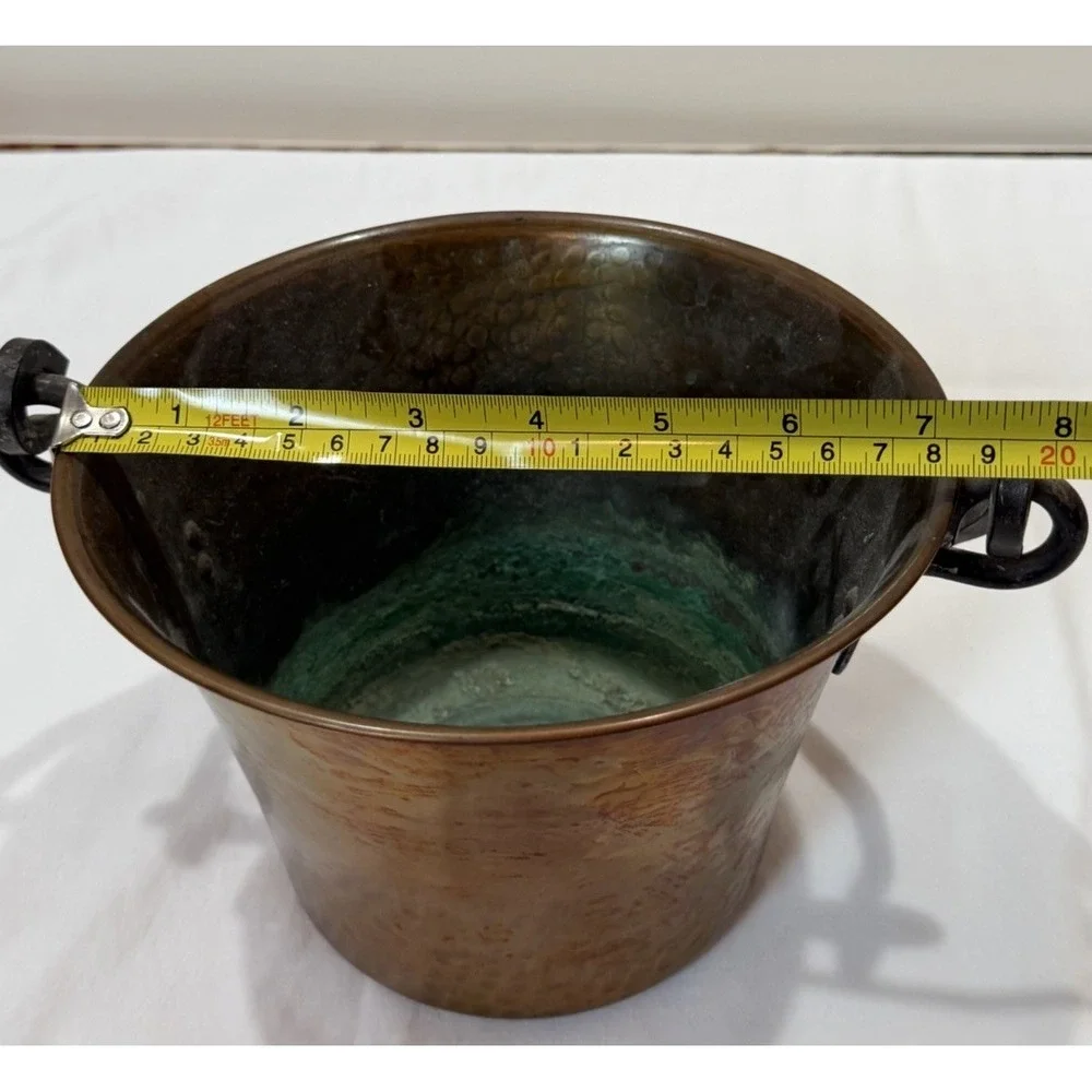 Hammered copper pot with a wrought iron handle, made by Stockli Netstal. VINTAGE